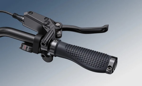 Close-up of the right handlebar on the Engwe Engine Pro 3.0 Boost showing the seven-speed Shimano gear shifter with indicator, brake lever, textured grip and thumb throttle