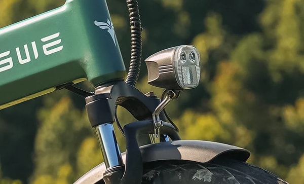 Engwe EP-2 3.0 Boost front headlight close-up showing the dual LED lamps and mounting bracket